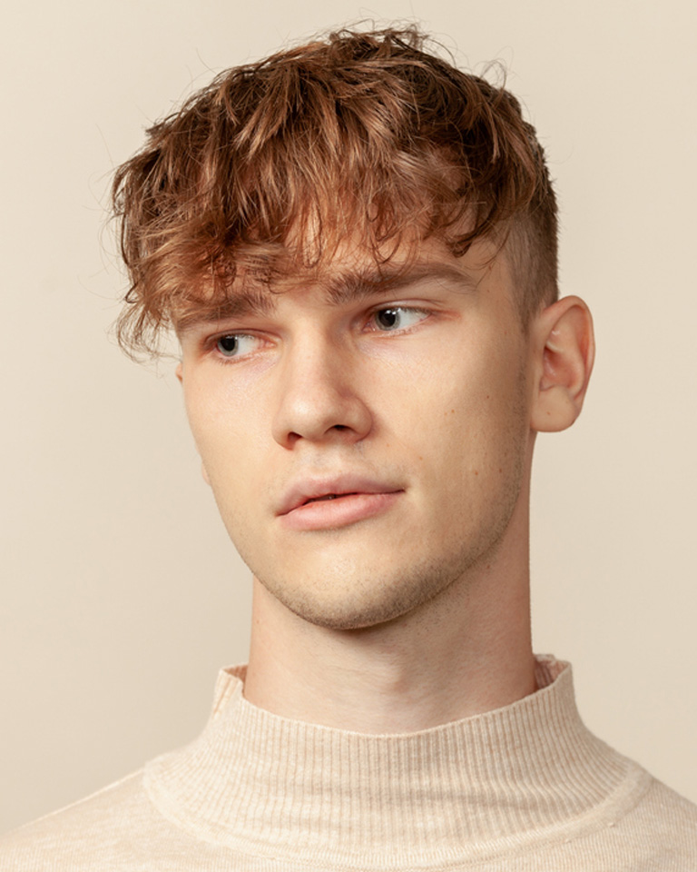 a close up of a boy looking at the camera