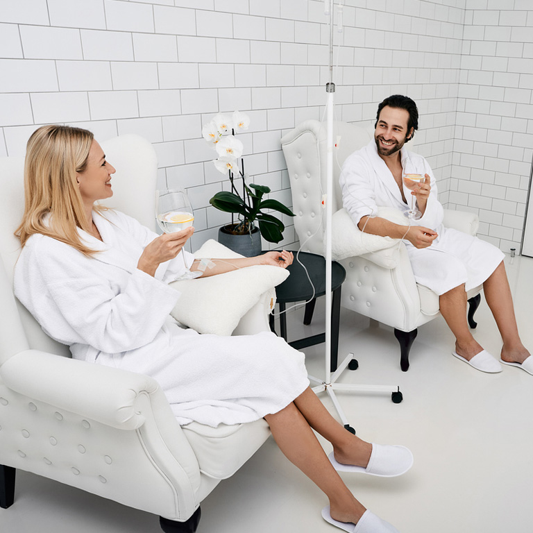 a man and a woman sitting on a table