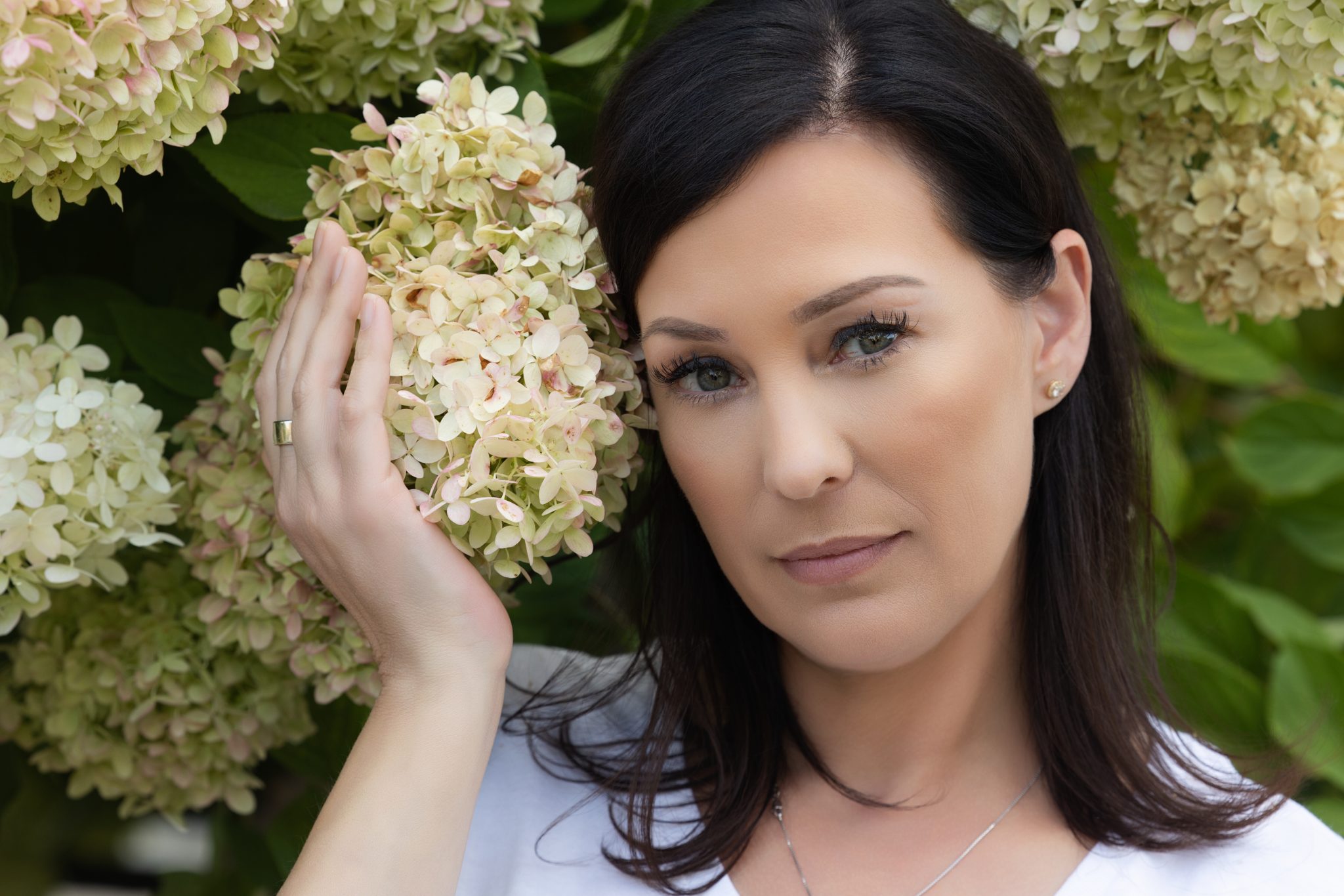 a woman holding a flower